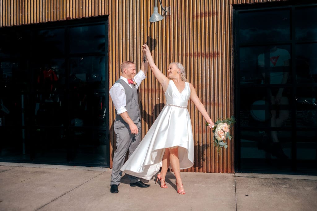 Bride and Groom Twirl at DoveCote Wedding - Orlando