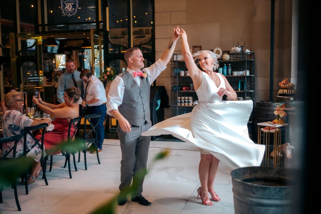 Bride and Groom twirl at DoveCote Wedding - Orlando